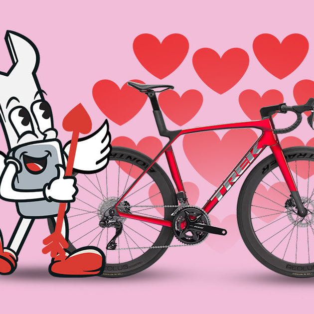 Cartoon cupid standing in front of a bicycle with hearts in the background / Cupidon cartoon devant un vélo, cœurs en arrière-plan