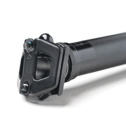 Close-up of a black bicycle seat post on a white background