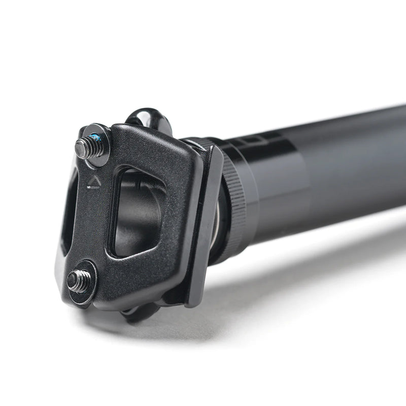 Close-up of a black bicycle seat post on a white background