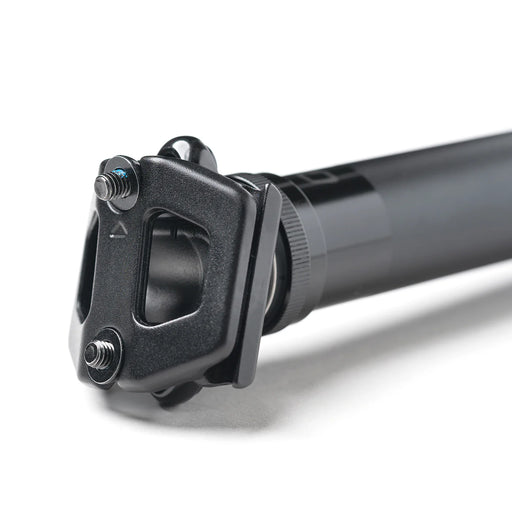 Close-up of a black bicycle seat post on a white background