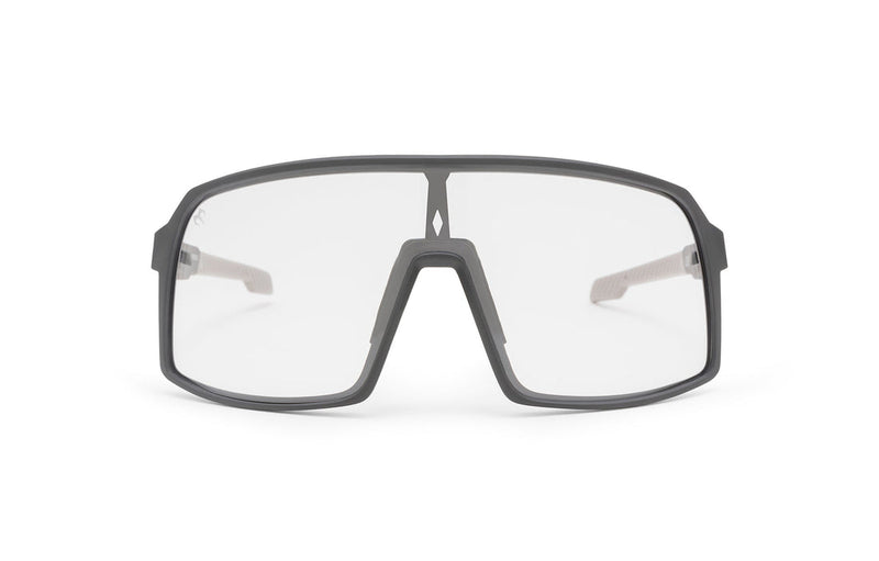 Carbon Black x Crystal sunglasses, front view with black frames, black stems with light grey ends and transparent lenses on a white background
