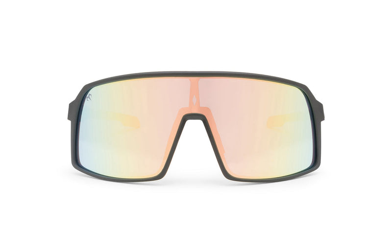 Carbon Black x Rose sunglasses, front view with black frames, black stems with pink ends and peach, blue and yellow gradient lenses on a white background