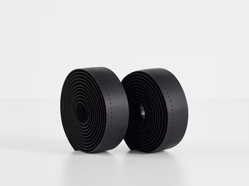 Two rolls of Perfline XL handlebar tape in black, showing the extra‑tacky perforated texture.
