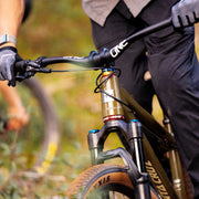 Close-up of a mountain bike with a blurred natural background
