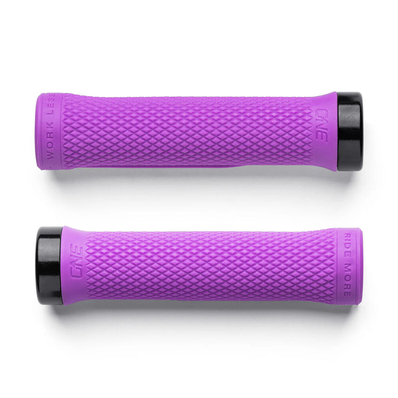 Two purple bicycle grips with black ends on a white background