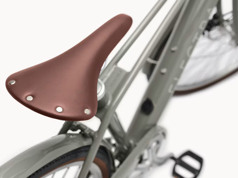 Closeup of saddle on grey bike 
(Electra Loft Go! 7D EQ Step-Over)