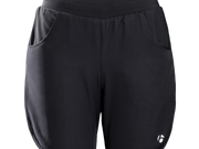 Bontrager Kalia women's cycling shorts front view product image in black, featuring a relaxed fit, lightweight shell construction, adjustable drawcord waistband, dual hand pockets, and Bontrager logo detail on the lower right leg.