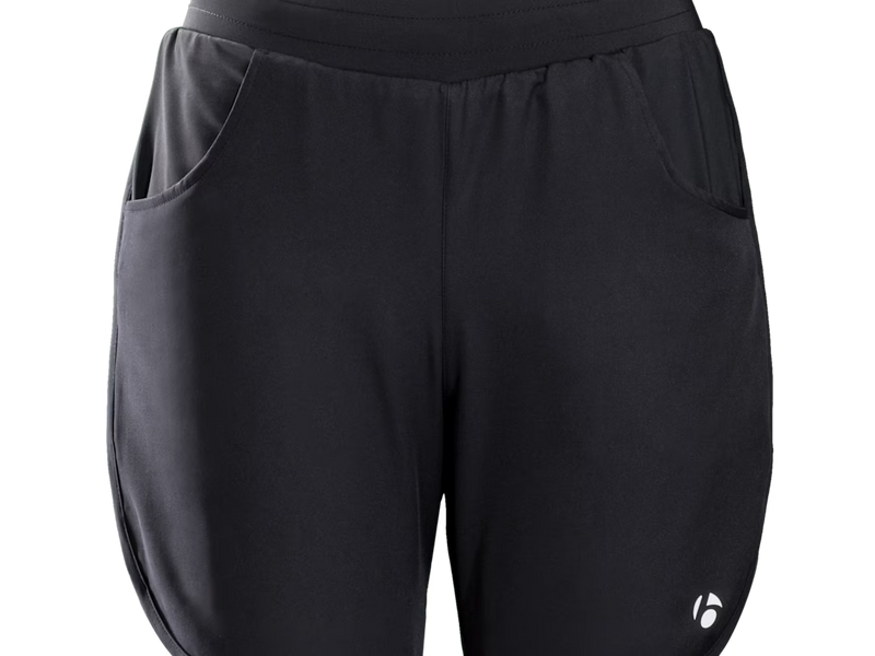 Bontrager Kalia women's cycling shorts front view product image in black, featuring a relaxed fit, lightweight shell construction, adjustable drawcord waistband, dual hand pockets, and Bontrager logo detail on the lower right leg.