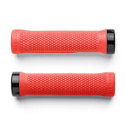 Two red bicycle grips with black ends on a white background