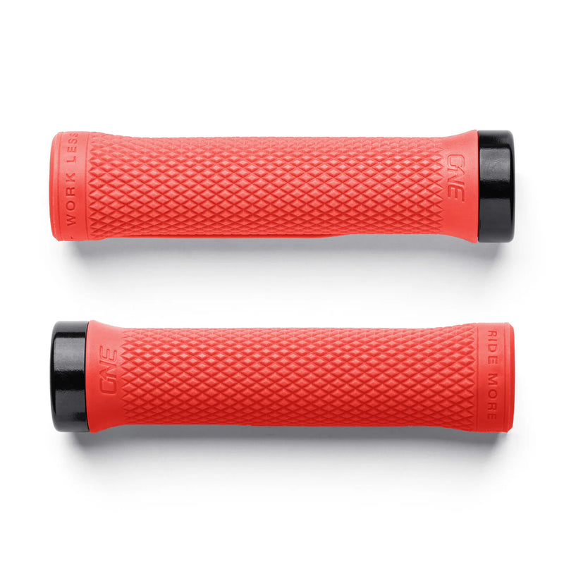 Two red bicycle grips with black ends on a white background