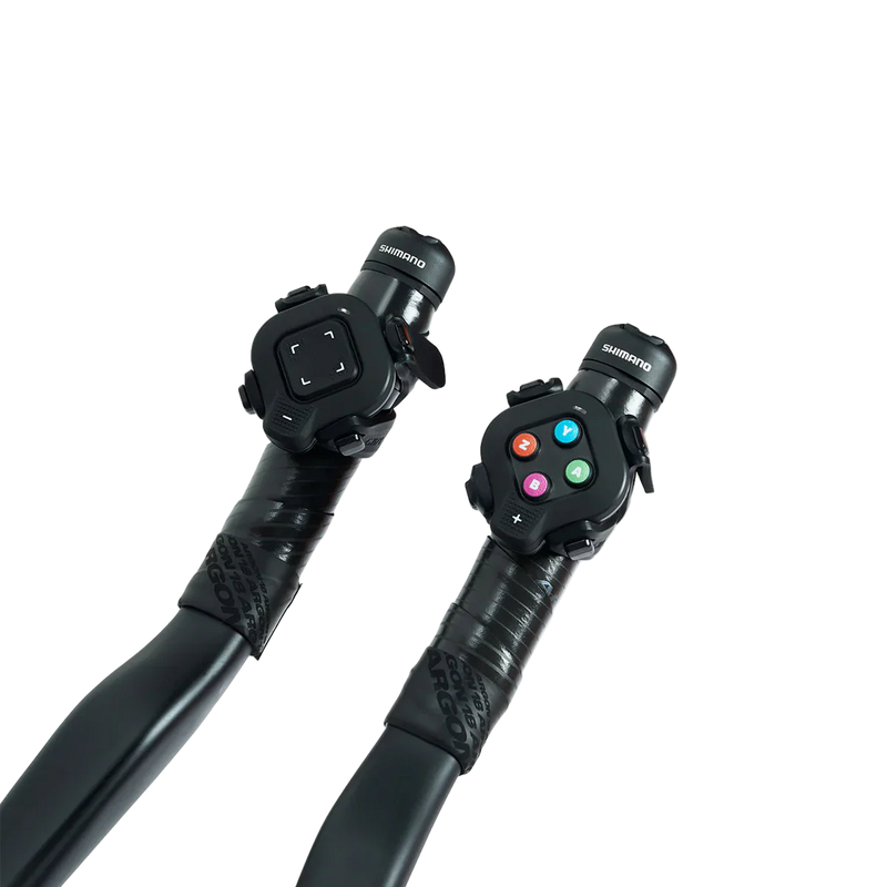 Zwift Click V2 controllers mounted on aero bar extensions on a transparent background.