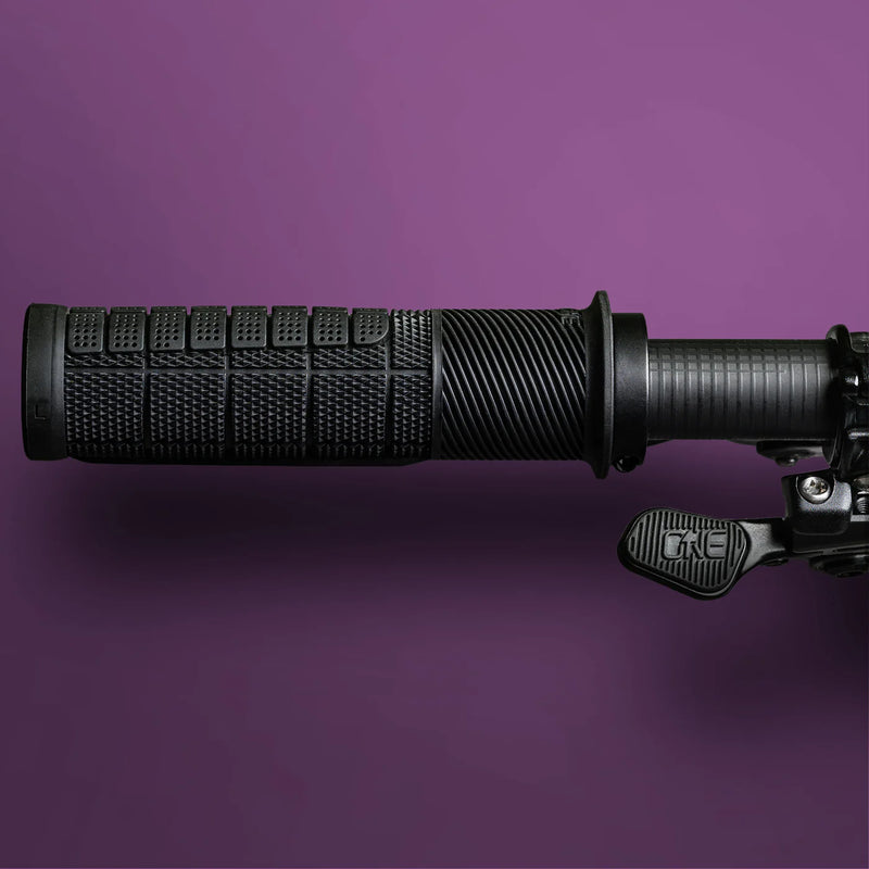 Black motorcycle handlebar grip on a purple background