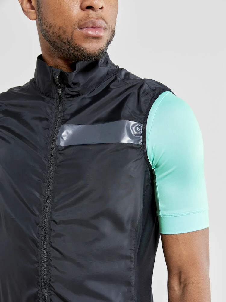 Craft Essence Light wind vest in black, close-up of shoulder and chest showing zipper, collar, and elastic armhole edge