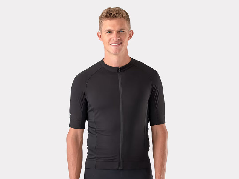 Man wearing a black cycling jersey on a white background