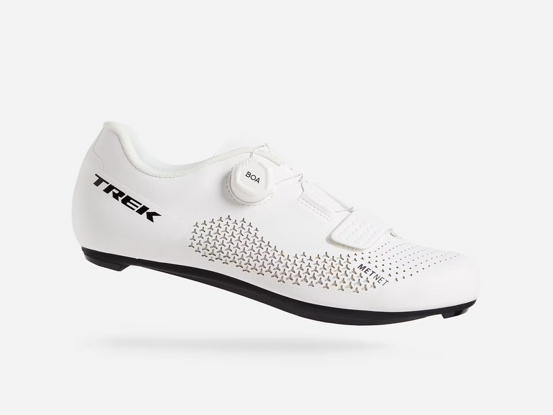 White cycling shoe with black sole and 'Trek' branding on a white background