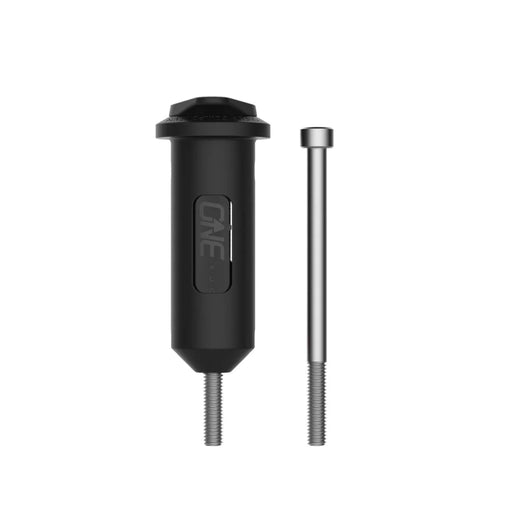 Black cylindrical tool with a silver threaded rod on a white background