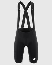 Black cycling bib shorts with suspenders on a light gray background