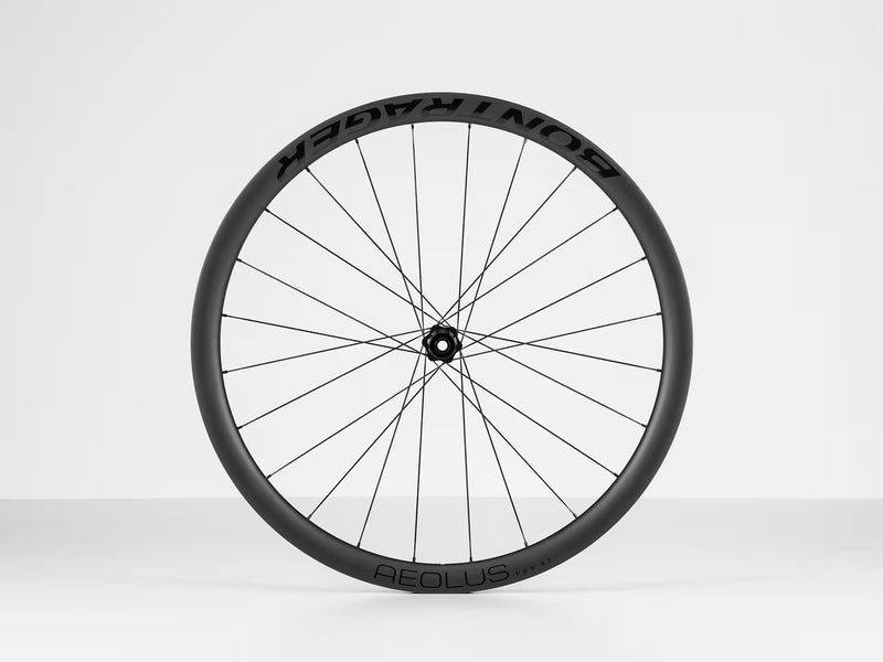 Black bicycle wheel with BONTRAGER AEOLUS' branding on a white background