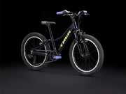 Black bicycle with 'Trek' branding on a black background
