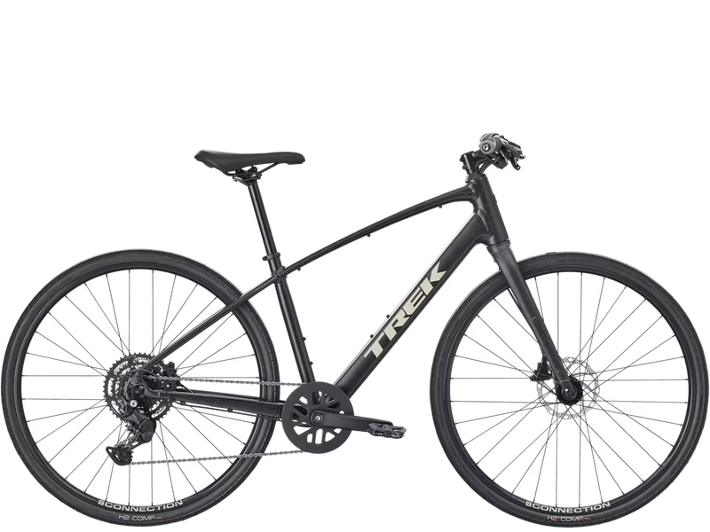 A black Trek hybrid fitness bicycle with a matte finish, featuring a step-through frame, rear suspension, and disc brakes, shown against a plain white background.
