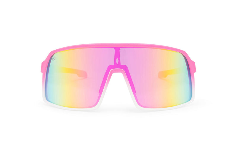 Pink x Pink sunglasses, front view with pink and white frames, pink stems and blue, yellow and pink gradient lenses on a white background