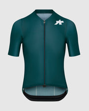 Green cycling jersey with a logo on a light gray background
