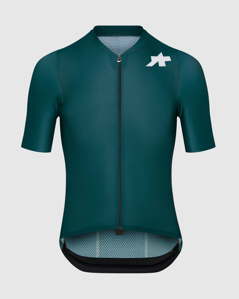 Green cycling jersey with a logo on a light gray background