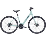 Light blue bicycle with 'Trek' branding on a transparent background