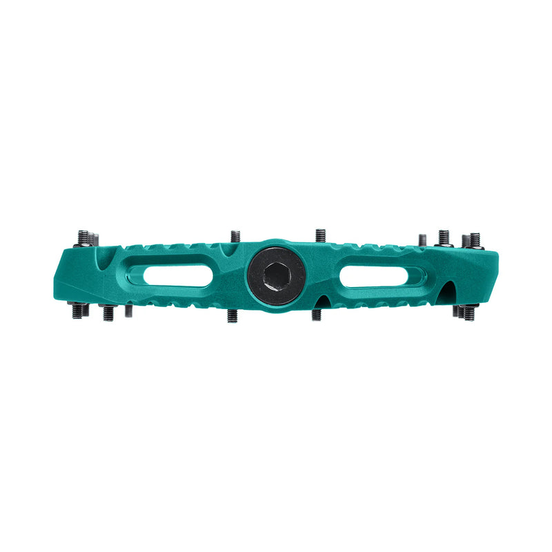 Teal metal component with black center on a white background