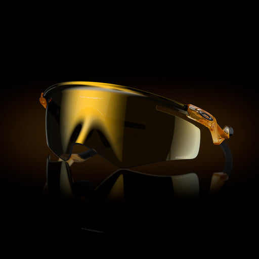 Sunglasses with gold reflective lenses on a dark background