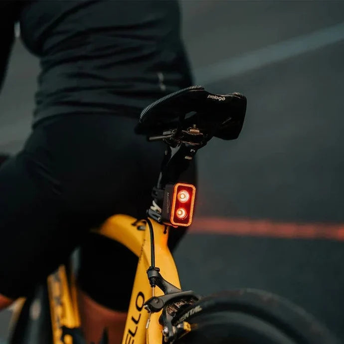 Lifestyle image of the Magicshine Seemee 300 taillight mounted to the back of a bicycle seatpost