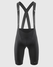 Black cycling bib shorts with straps on a light gray background