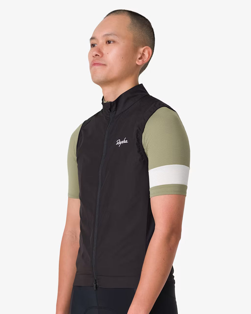 Rapha Core Cycling Gilet worn by a model, side view with full-length zipper closed and mock-neck collar visible