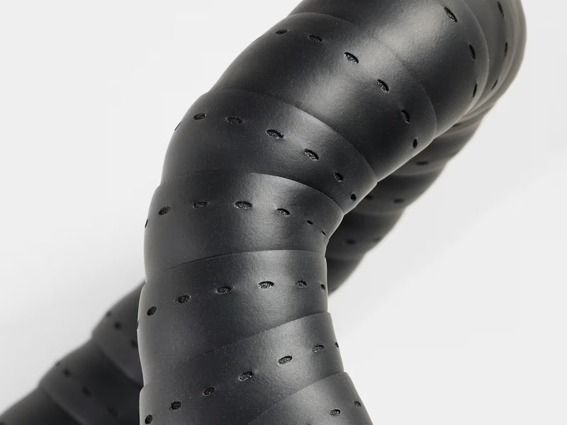 Close‑up of Perfline XL handlebar tape installed on a road bike, highlighting its tacky textured grip and perforated finish.