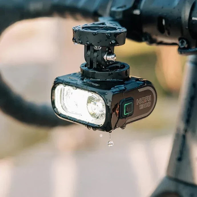 Lifestyle closeup image of hori 1300 attached to bike handlebar, in the rain