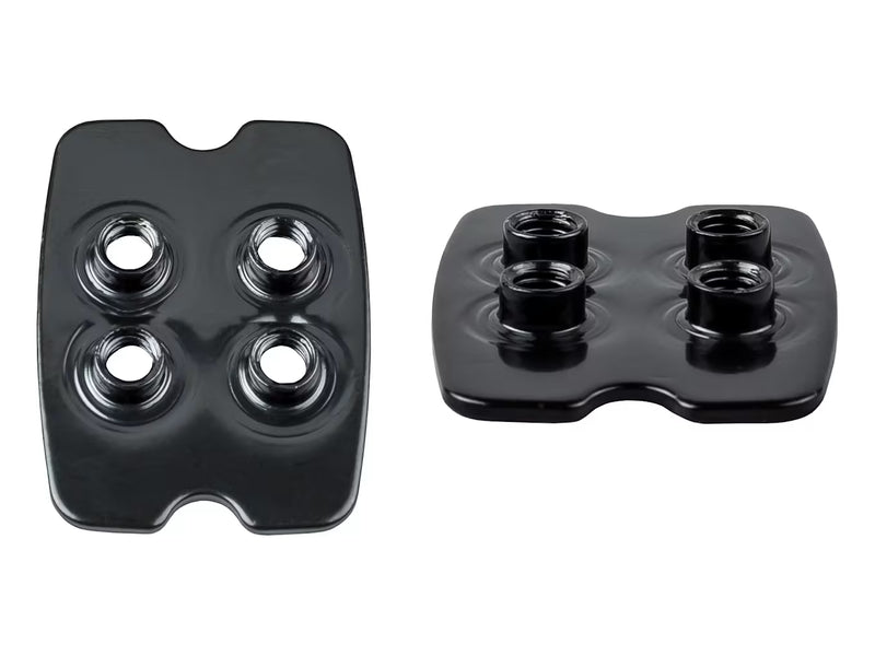 Pair of black square Bontrager SPD adapter plates featuring four threaded mounting holes and raised outer interlocking borders