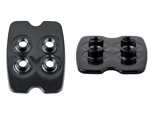 Pair of black square Bontrager SPD adapter plates featuring four threaded mounting holes and raised outer interlocking borders