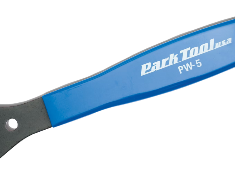 Close-up of a Park Tool PW-5 chain tool handle with a blue ergonomic grip and a dark metal end, featuring the Park Tool logo on a white background.