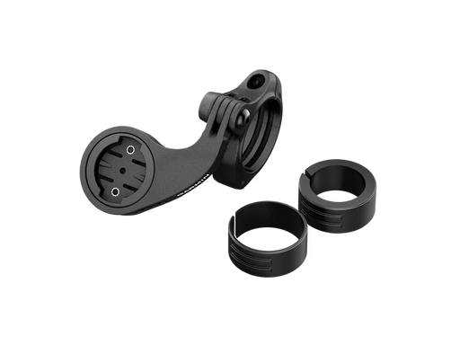 Close‑up of the Garmin Edge MTB computer mount with its clamp and two circular spacers, one thicker than the other, shown on a white background.