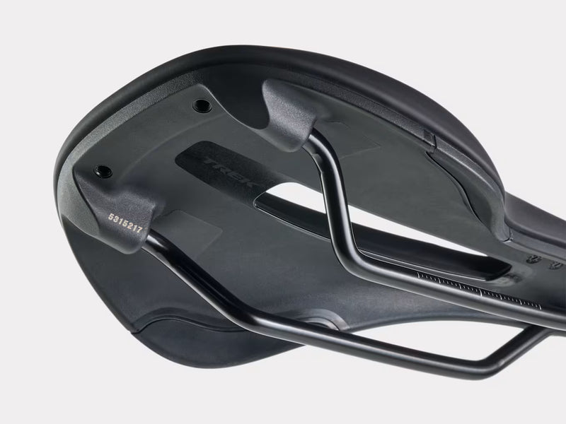 Close-up of a black bicycle saddle on a light gray background