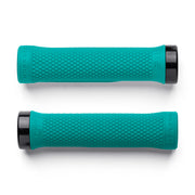 Two teal bicycle grips with black ends on a white background