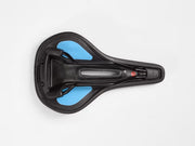 A top-down view of a black bicycle saddle with bright blue inserts on the sides, set against a clean white background.