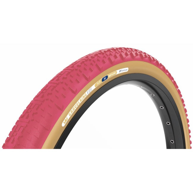 A close-up of a bicycle tire with a bright cranberry coloured tread, tan sidewall, and black inner tube, shown against a plain white background.