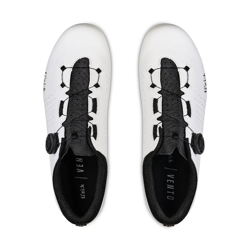 White cycling shoes with black accents on a white background