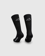 Two black socks with a logo on a light gray background