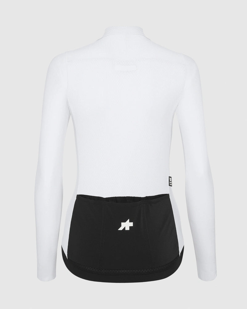 White long-sleeve athletic shirt with black waistband on a light gray background