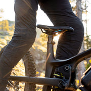 Person riding a mountain bike with a blurred natural background