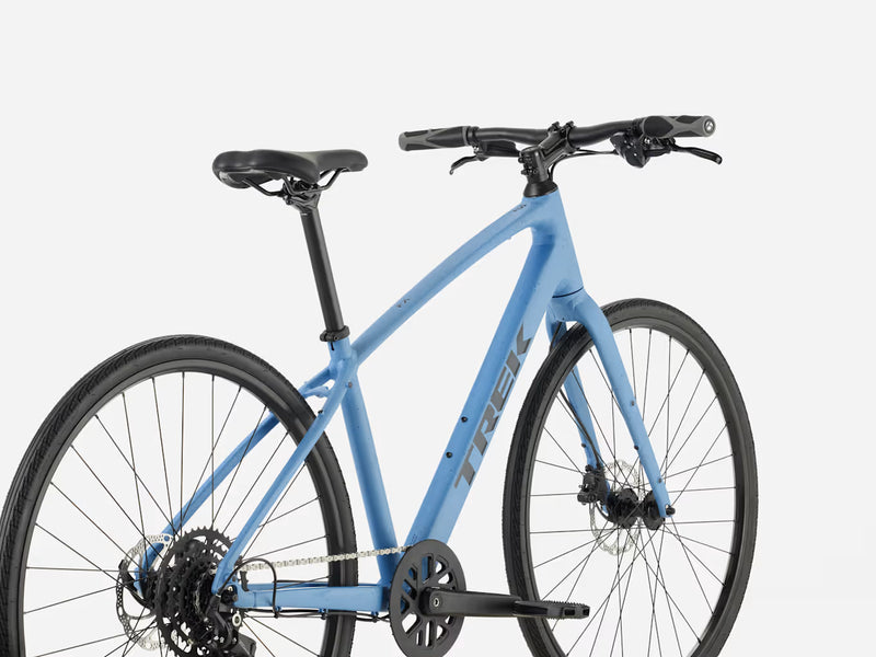 Blue hybrid fitness bicycle on a white background