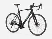 A black Trek road bicycle with drop handlebars, disc brakes, and a sleek carbon fiber frame, shown from a three-quarter angle against a light gray background.