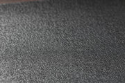 Close‑up of the JetBlack Trainer Mat’s textured black rubber surface.